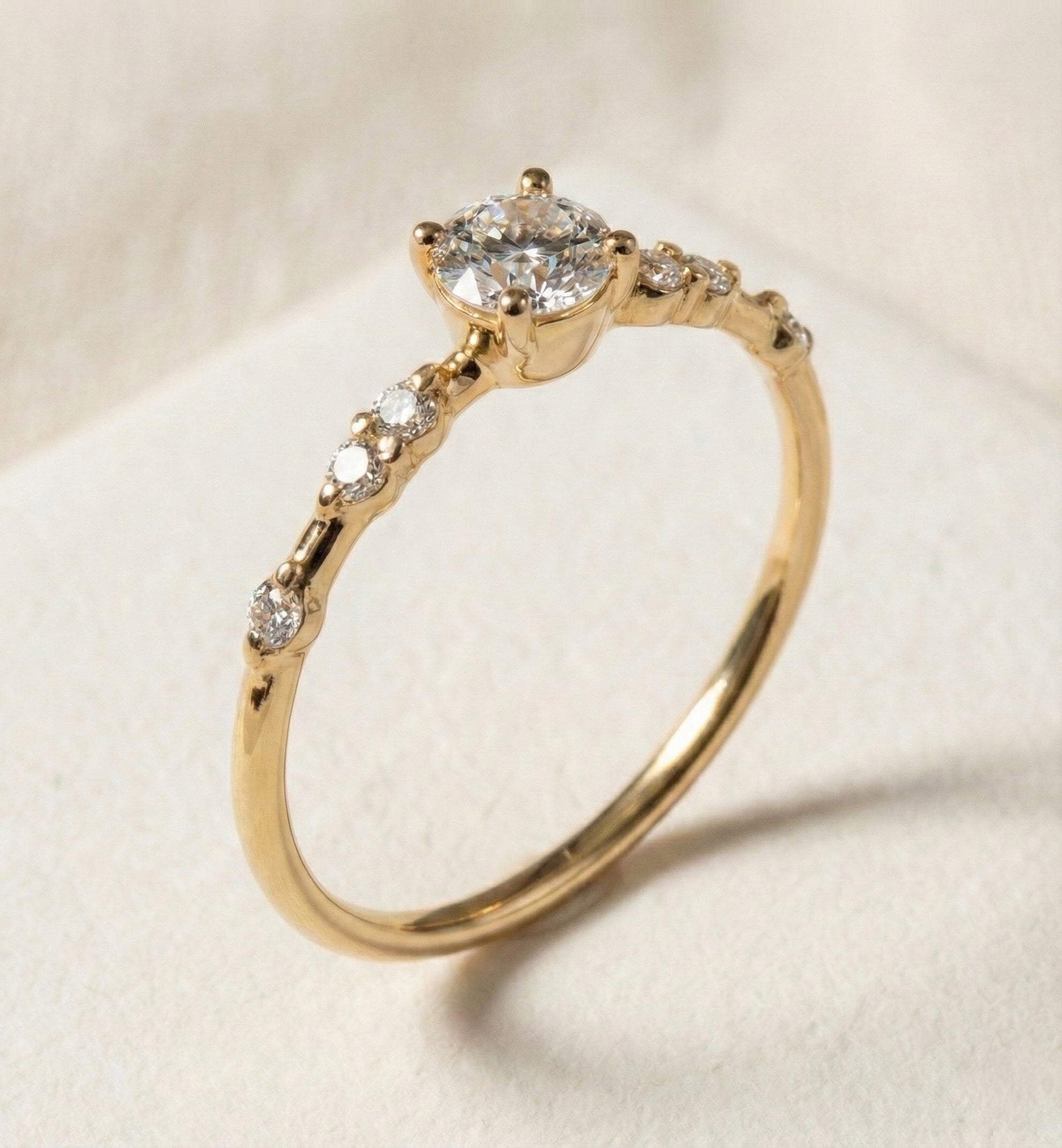 Handcrafted 14K gold salt and pepper diamond ring with a slim 1.6 mm band. The Lyrian model features a natural center salt and pepper diamond (unique inclusions, organic galaxy-like patterns), complemented by three precisely arranged side stones for a balanced, elegant light curve. Ethically sourced materials, refined low-profile prong setting, and a timeless, minimalist design that highlights the stone’s natural character. Perfect for everyday wear, engagement, or fine jewelry collections.
